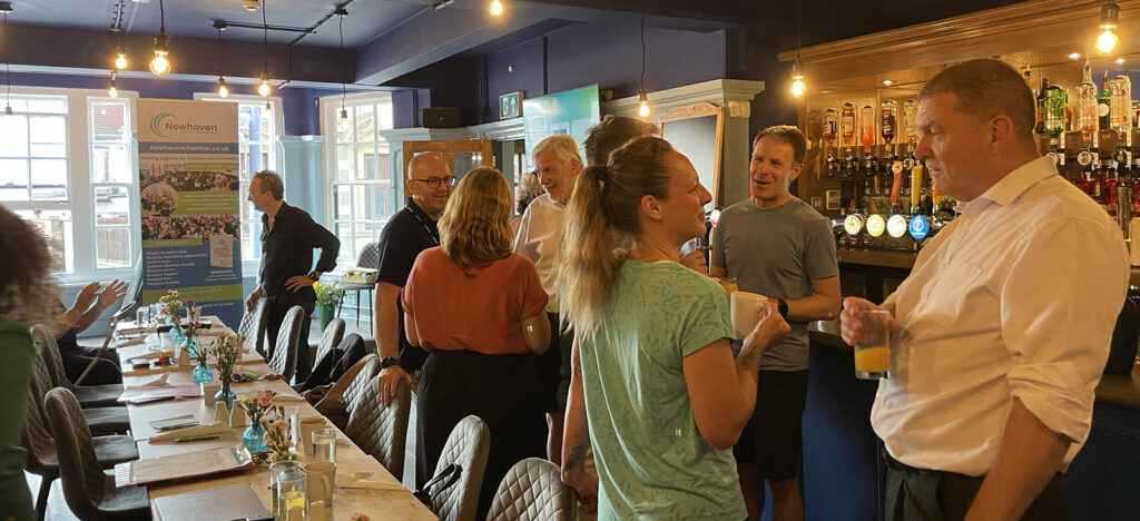 Newhaven Chamber members at the Ship in Newhaven stood talking prior to breakfast.