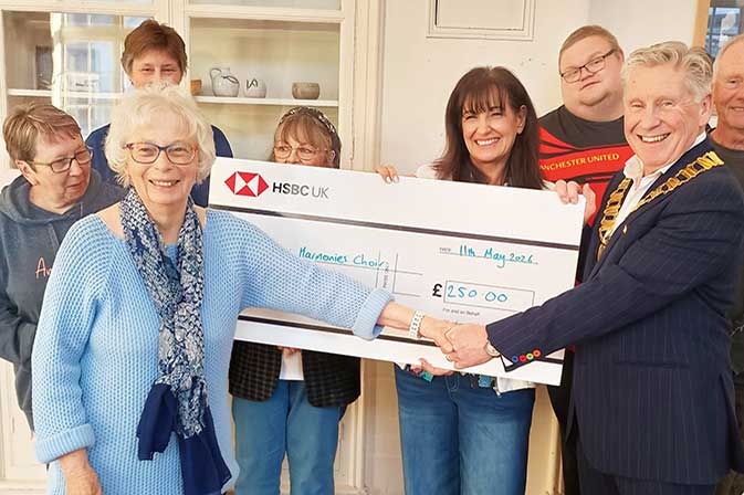 Newhaven Chamber President donates cheque to Haven Harmonies Choir